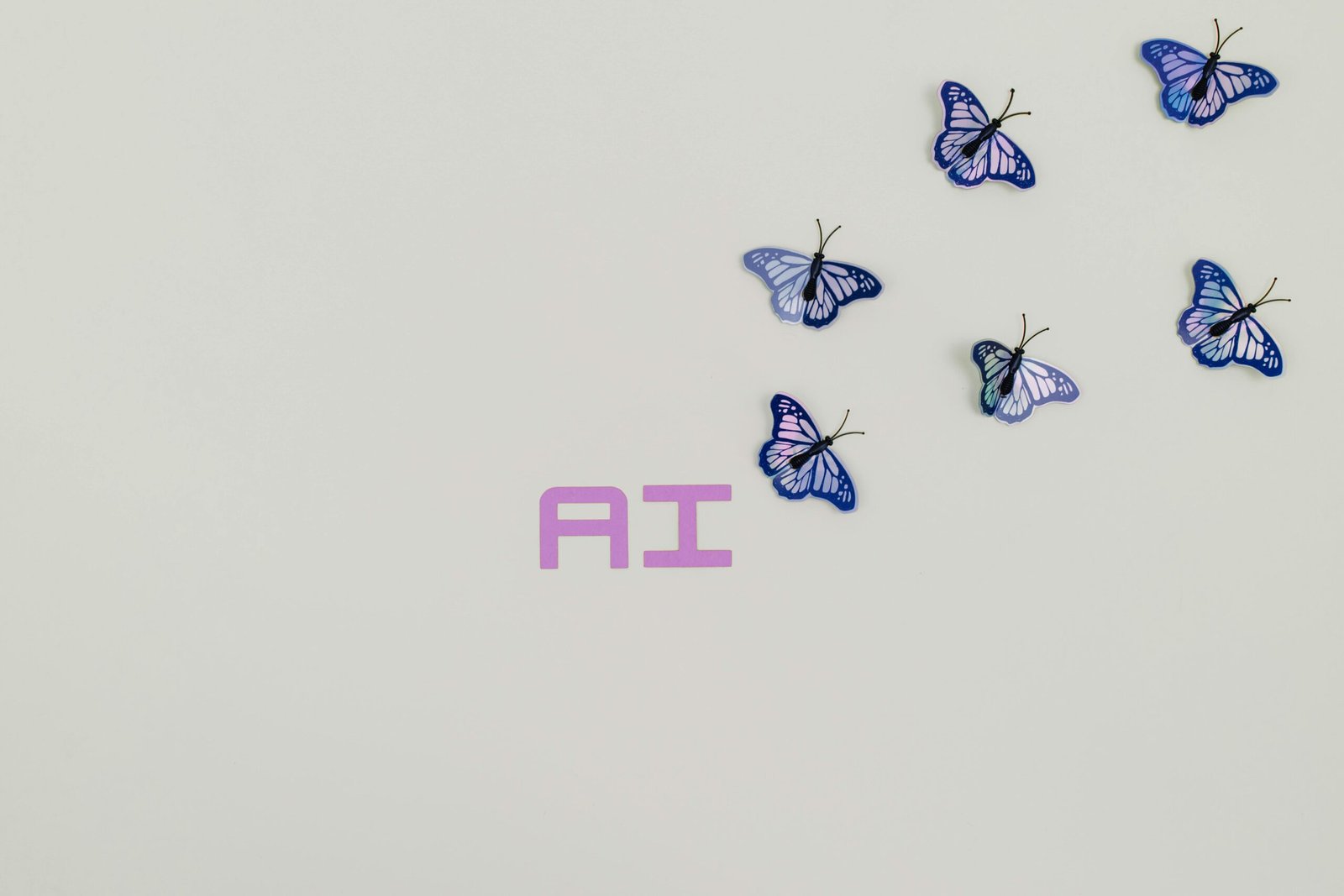 Home A creative image of butterflies flying over the word